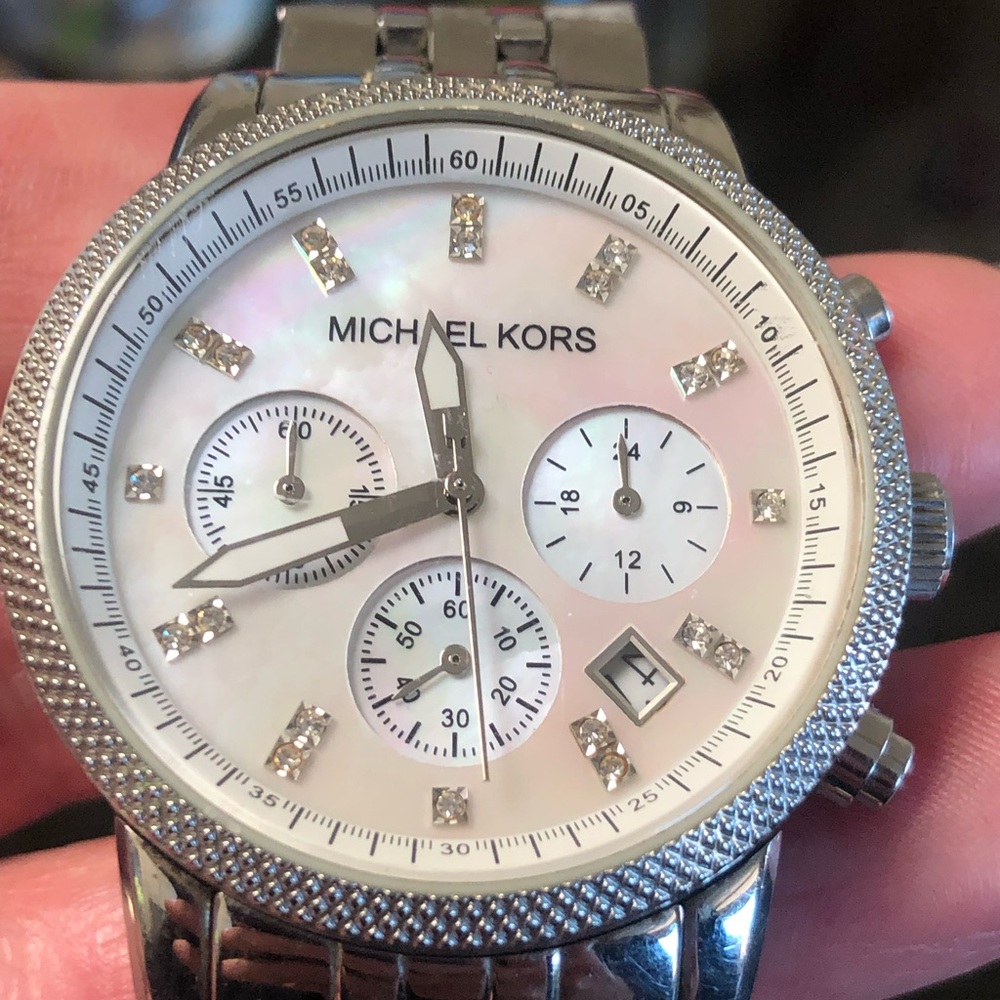 Michael Kors silver/mother of pearl, water resistant, extra links & new battery.